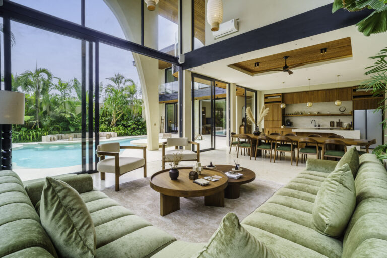 Luxury villa living room with pool view and tropical garden in Bali